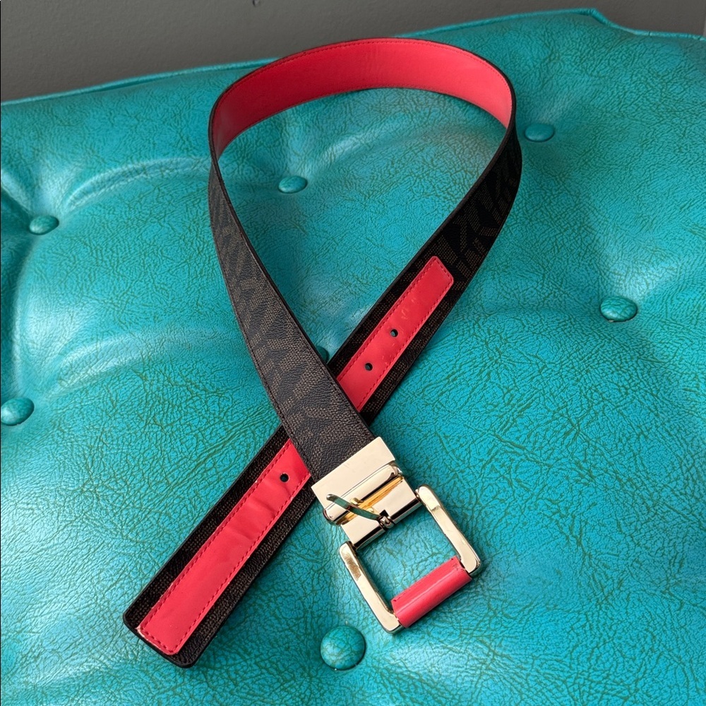 Reversible Michael Kors MK logo belt with bright shiny coral side - see flaw
